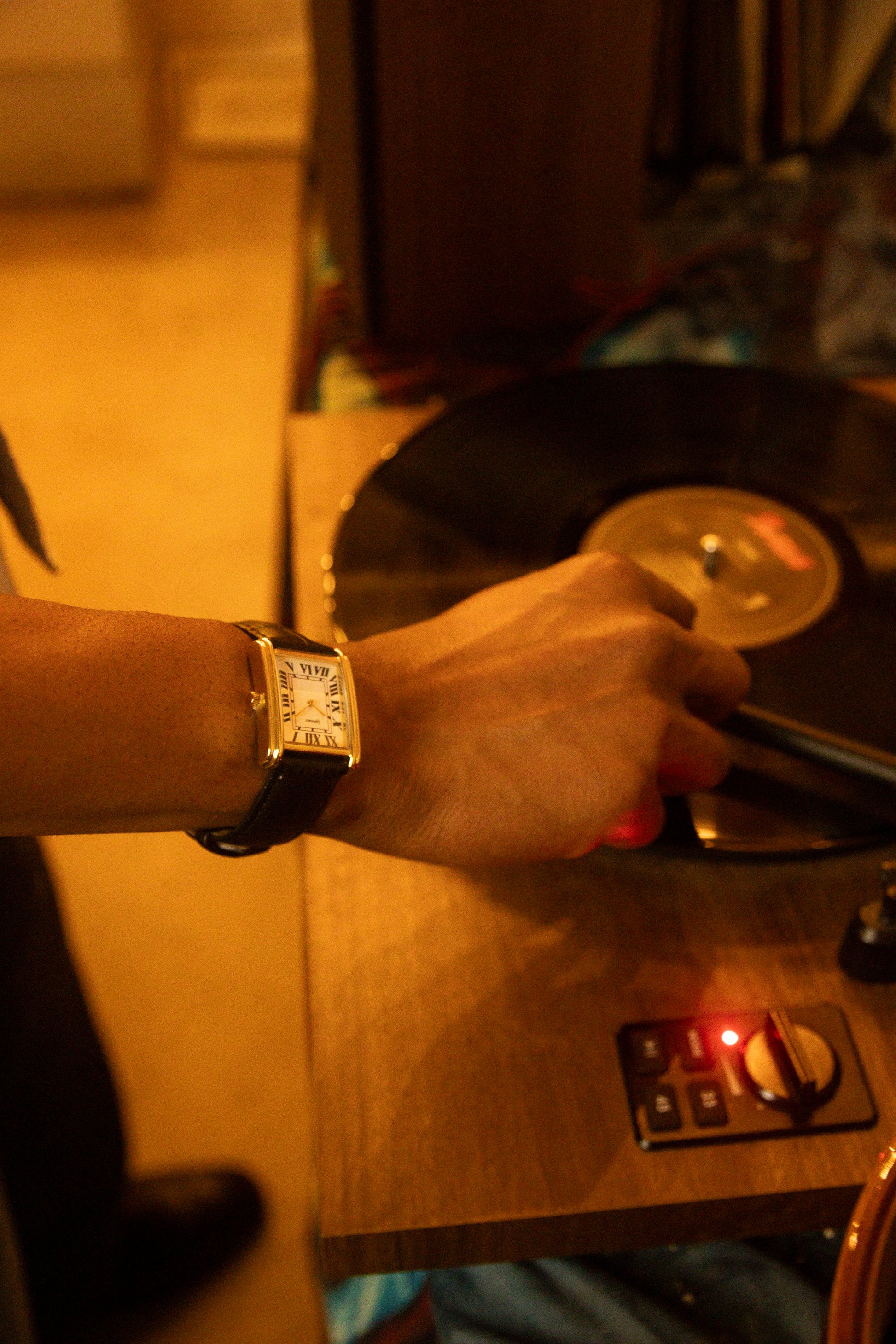 Bloc gold square dress watch worn on a wrist
