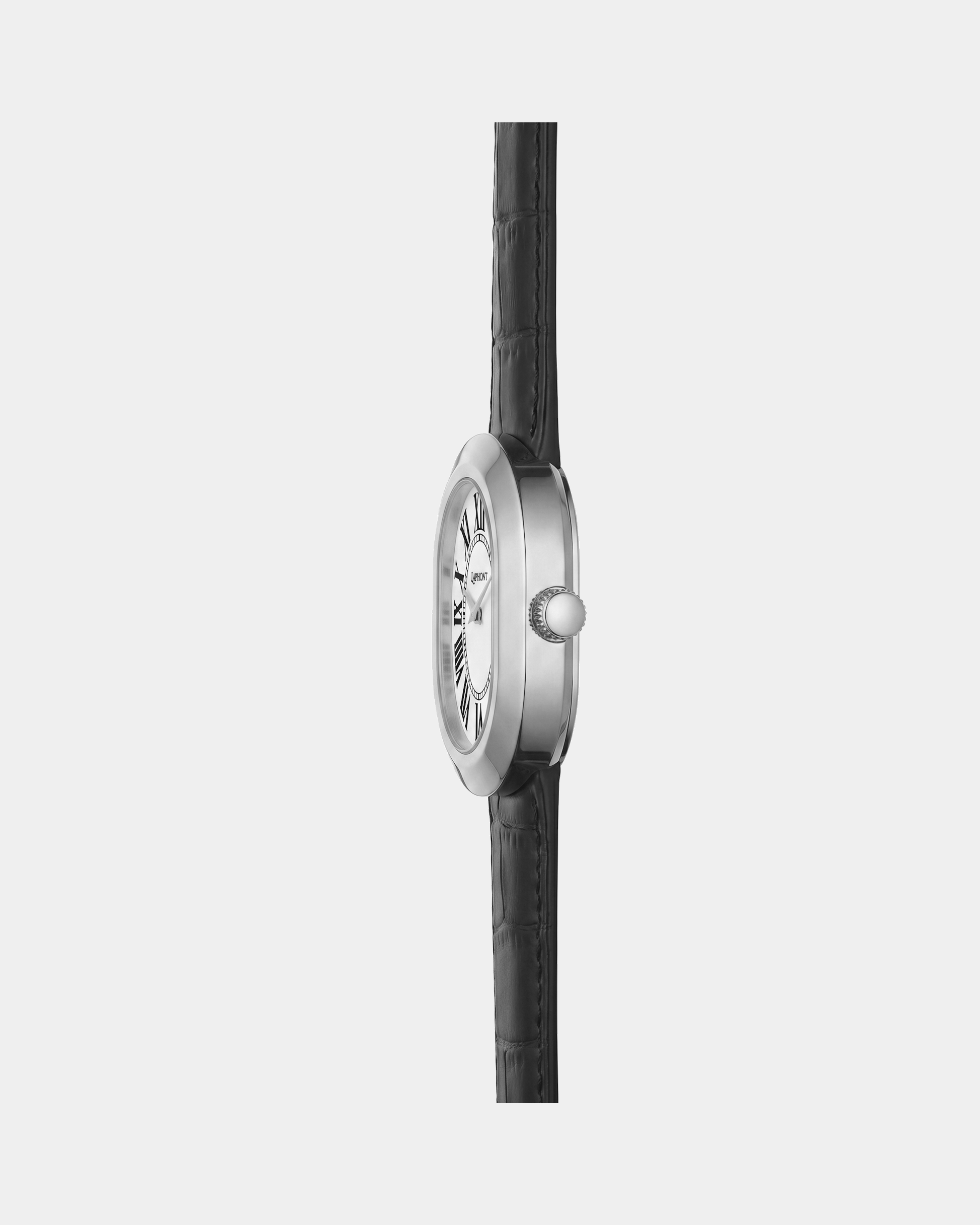 Oule oval silver dress watch with white Roman-numeral dial on black leather strap side view